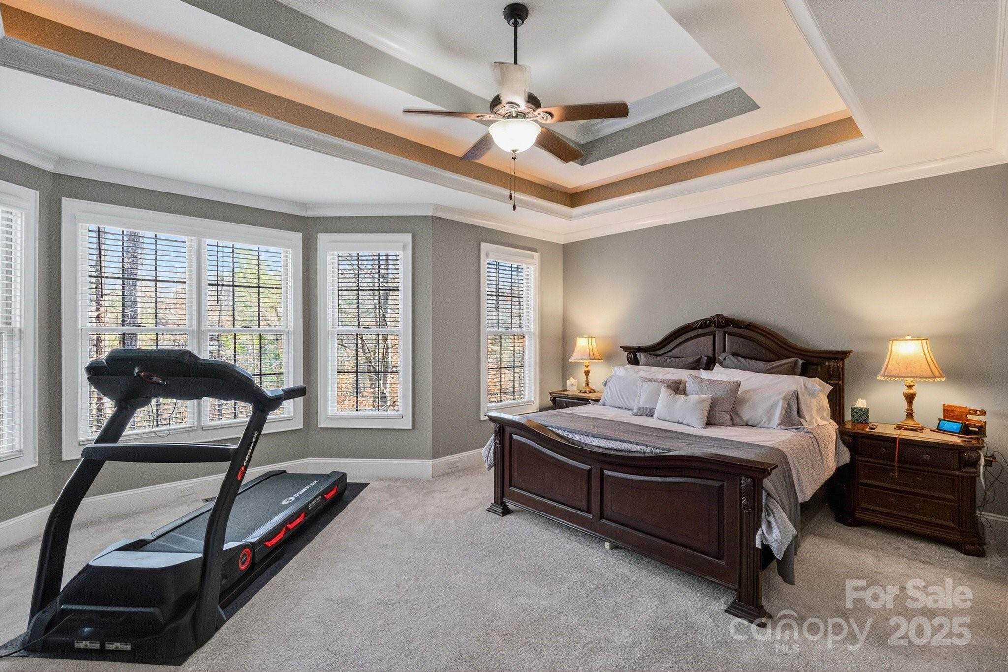 7653 Juniper Lane Denver, NC 28037 - Photo 18 of 43 a bedroom with a bed a couch and a window