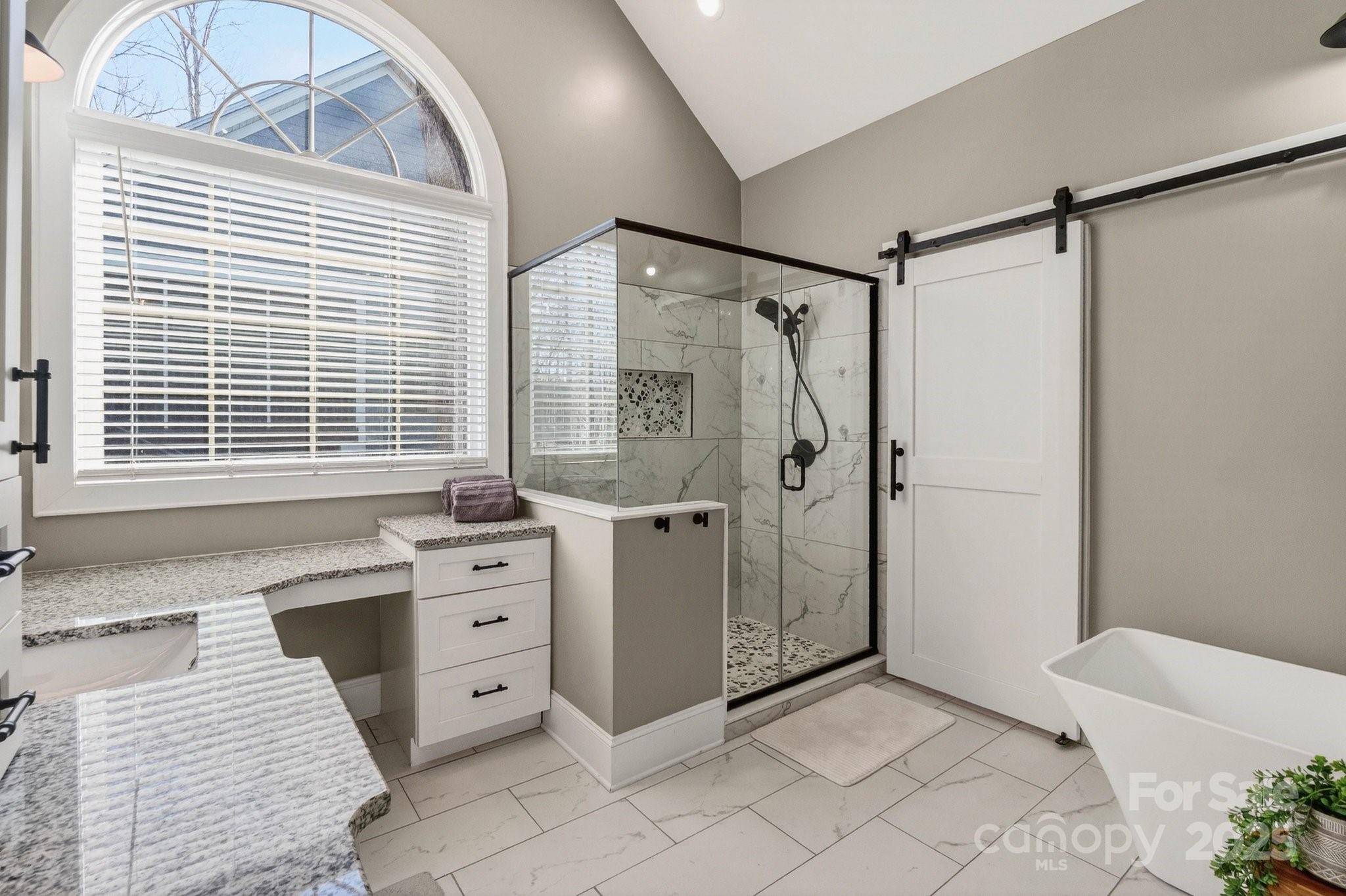 7653 Juniper Lane Denver, NC 28037 - Photo 21 of 43 a spacious bathroom with a shower and a sink