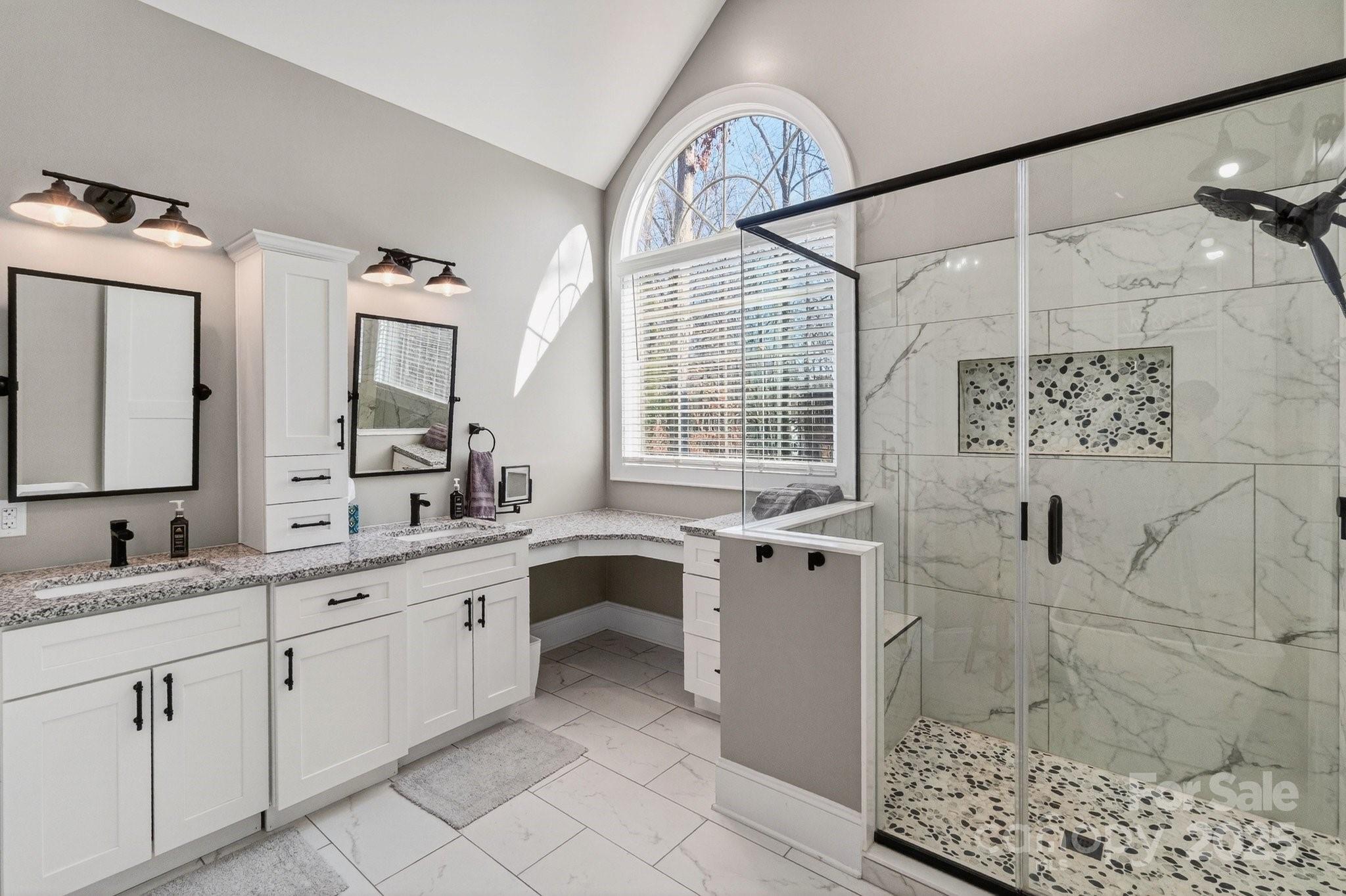 7653 Juniper Lane Denver, NC 28037 - Photo 22 of 43 a spacious bathroom with a double vanity sink a mirror and a shower