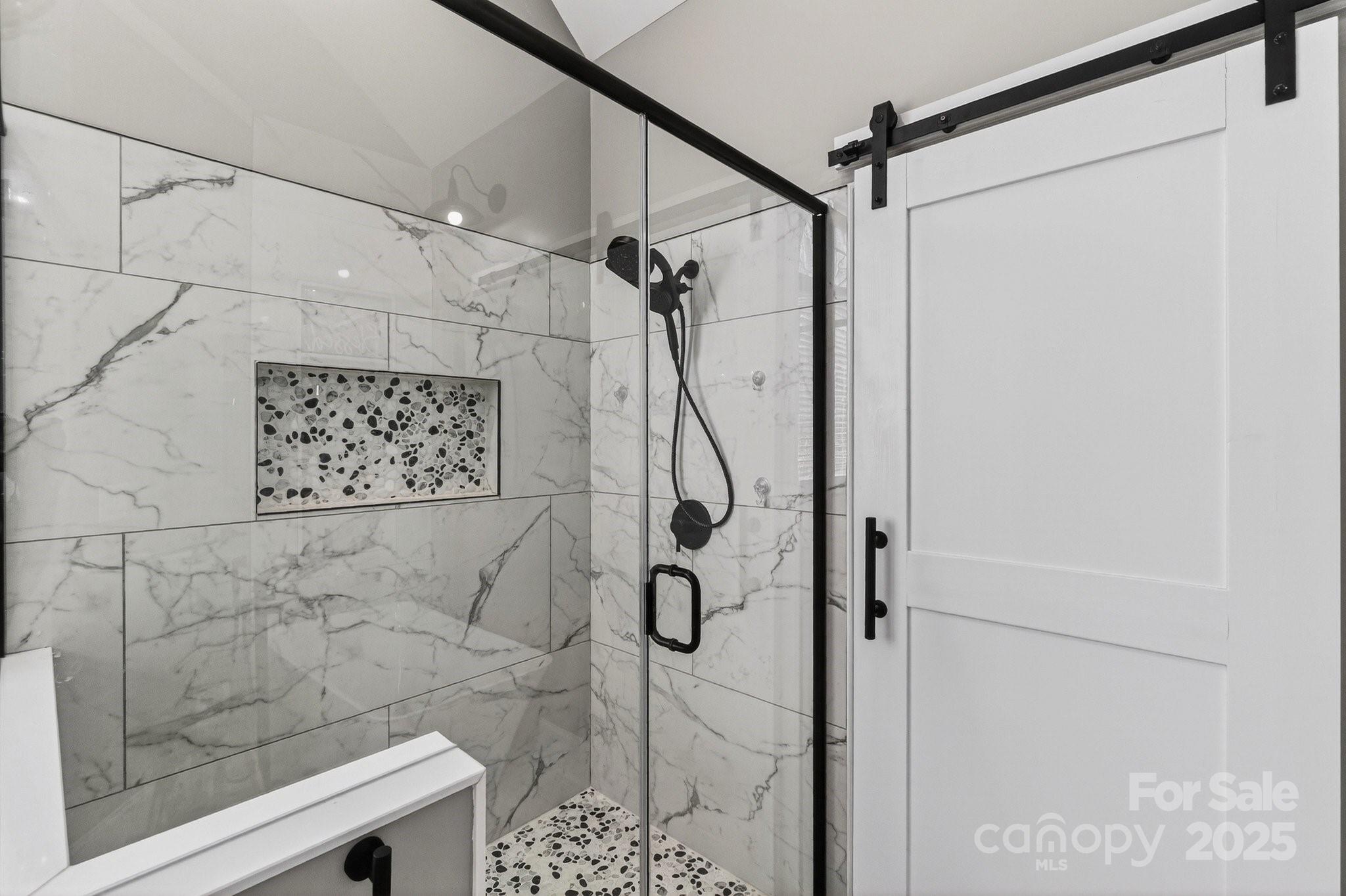 7653 Juniper Lane Denver, NC 28037 - Photo 24 of 43 a bathroom with a shower