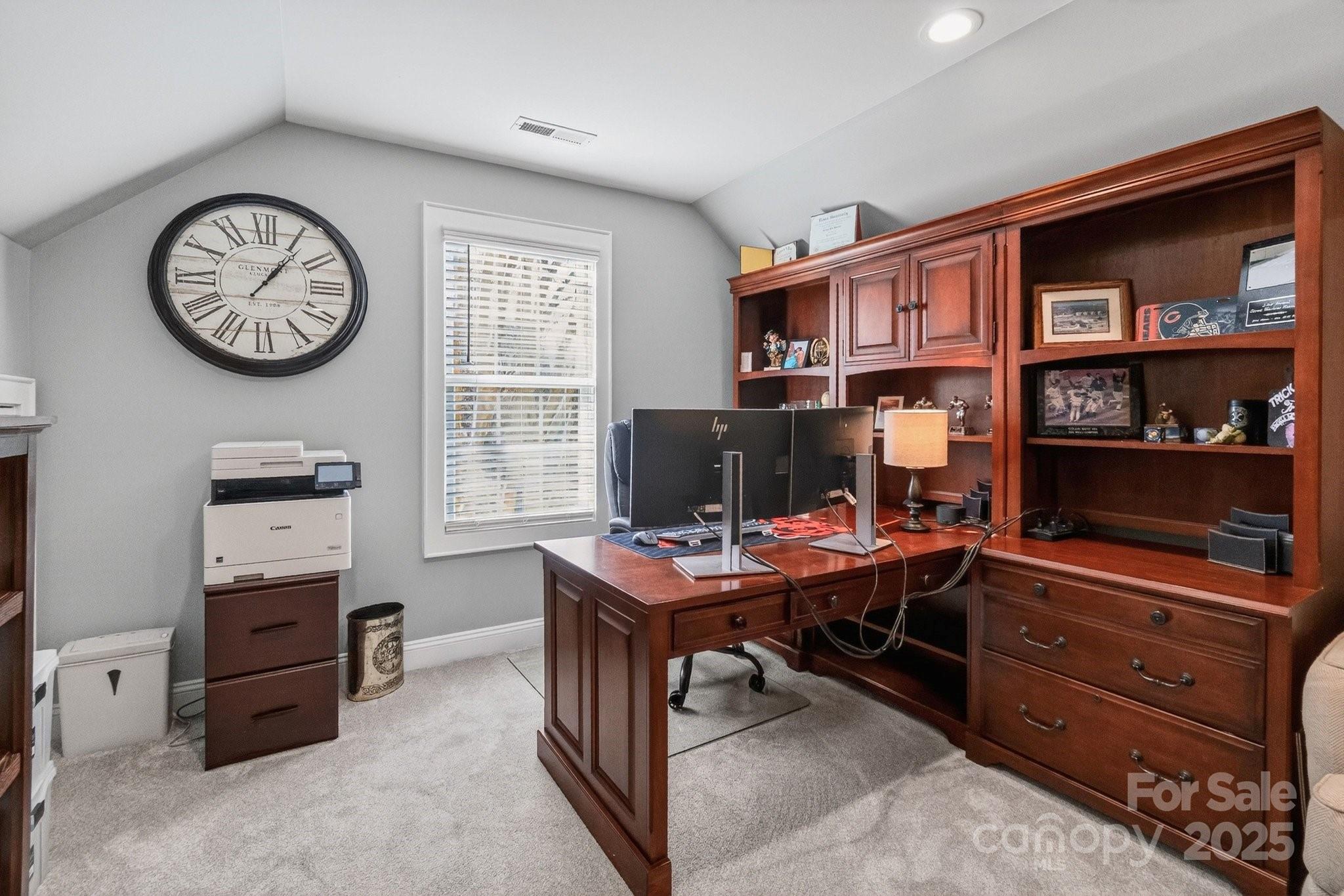 7653 Juniper Lane Denver, NC 28037 - Photo 26 of 43 a view of a workspace with furniture and a bookshelf