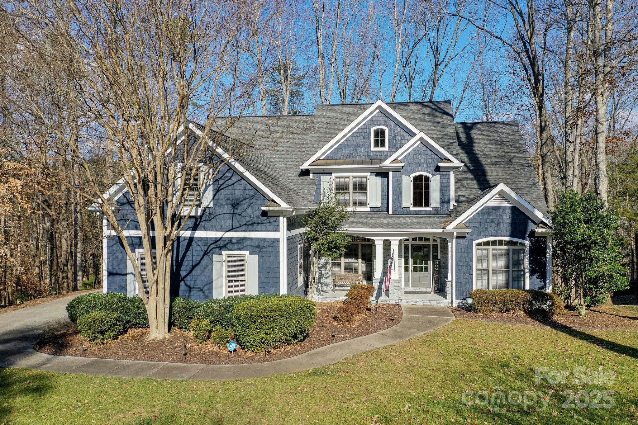 7653 Juniper Lane Denver, NC 28037 - Photo 3 of 43 a front view of a house with yard and green space