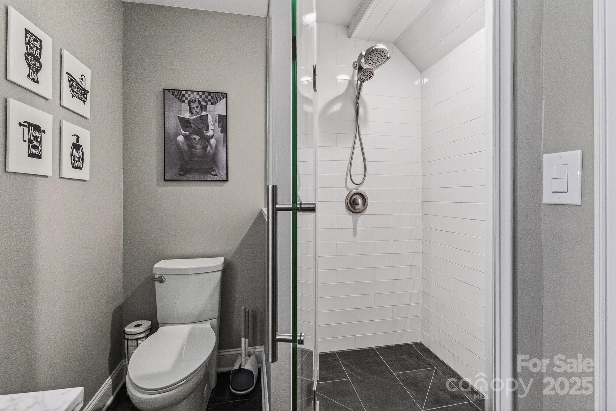 7653 Juniper Lane Denver, NC 28037 - Photo 32 of 43 a white toilet sitting next to a bathroom sink