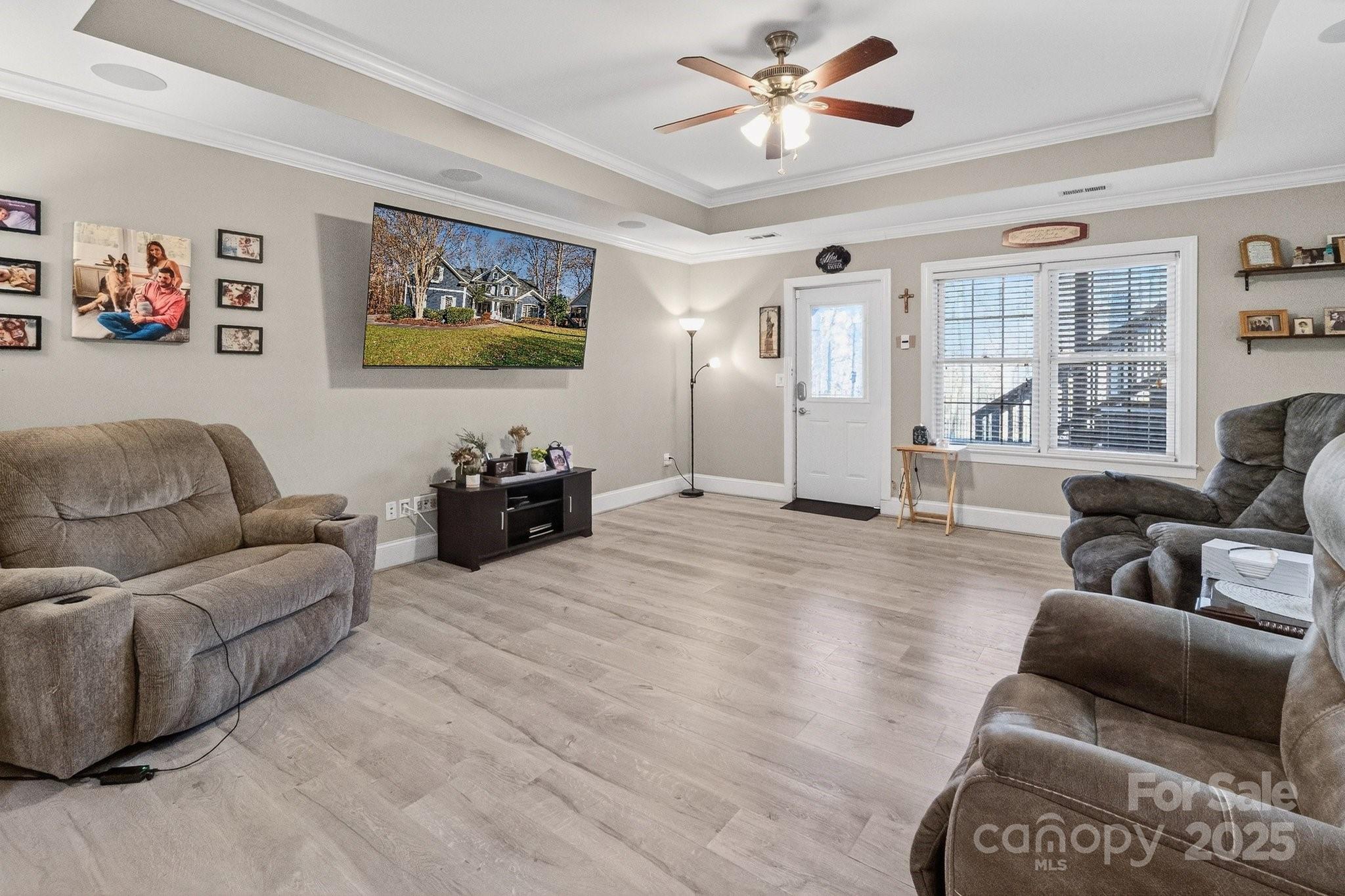 7653 Juniper Lane Denver, NC 28037 - Photo 33 of 43 a living room with furniture and a ceiling fan