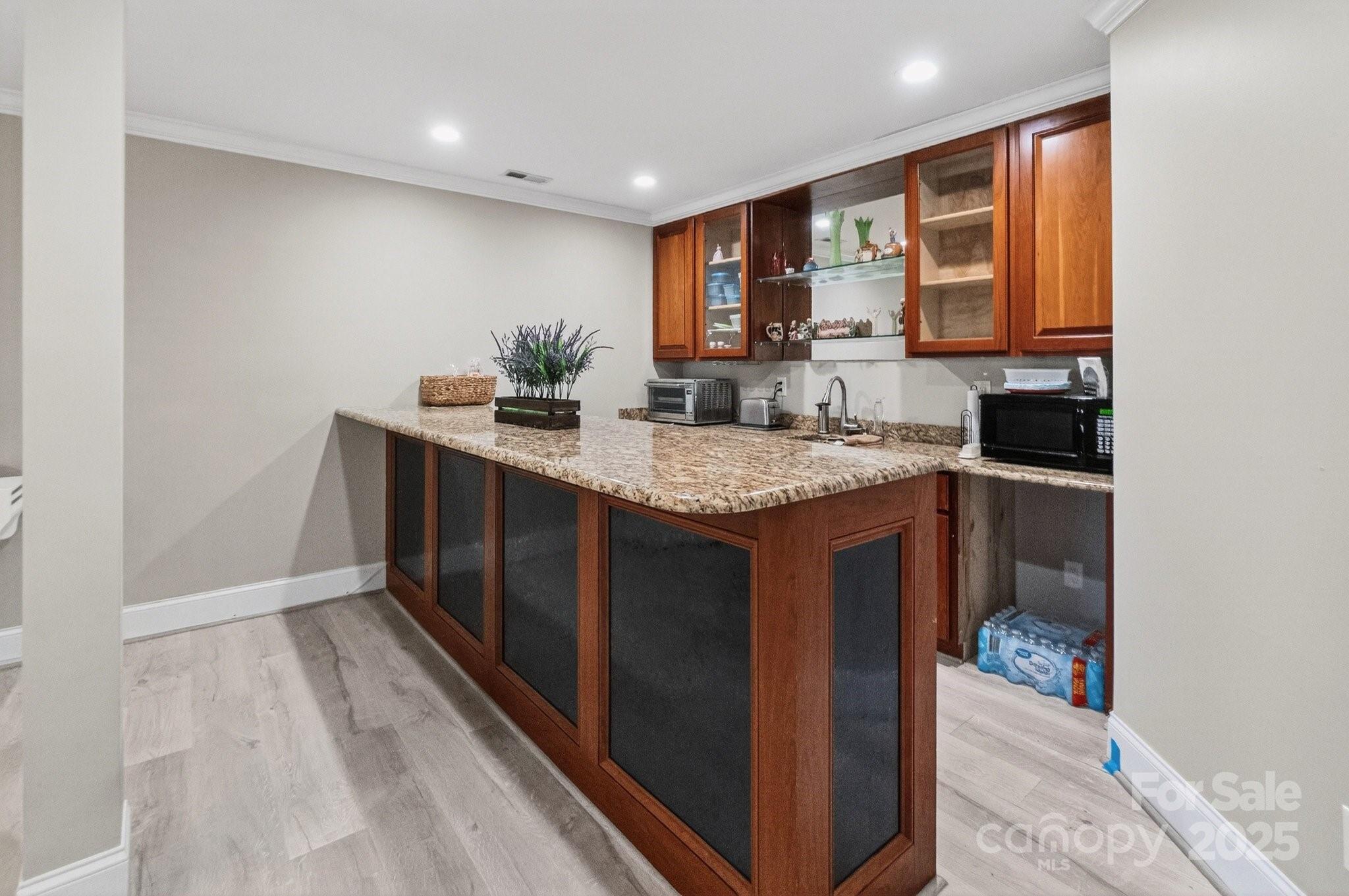 7653 Juniper Lane Denver, NC 28037 - Photo 37 of 43 a kitchen with a sink stove and cabinets