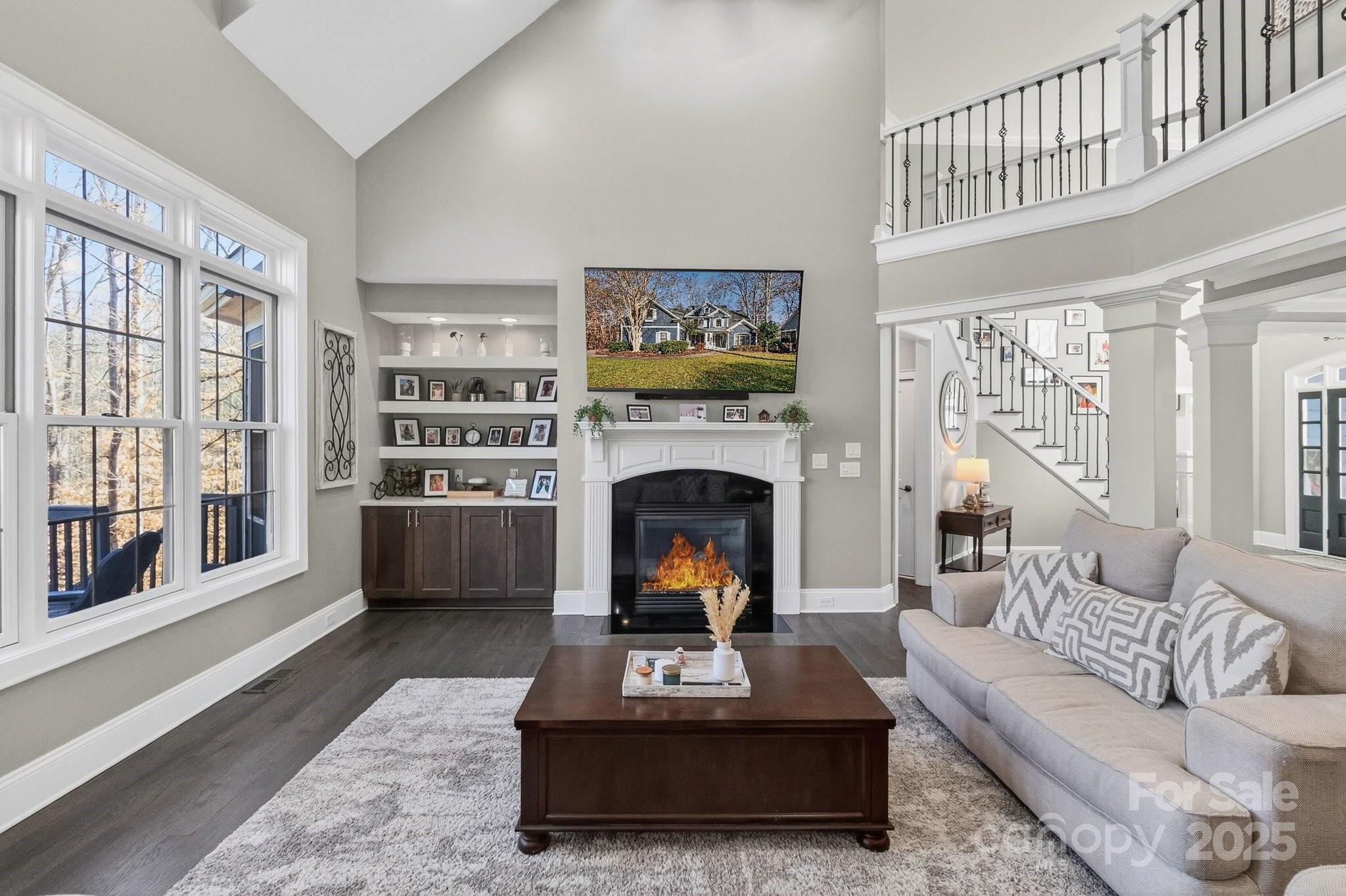 7653 Juniper Lane Denver, NC 28037 - Photo 9 of 43 a living room with furniture a fireplace and a large window