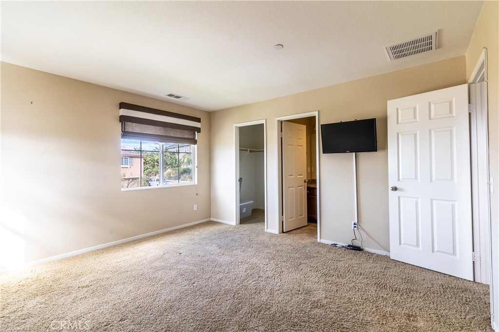 16657 Golden Bluff Loop Riverside, CA 92503 - Photo 20 of 47 a view of an empty room with a window