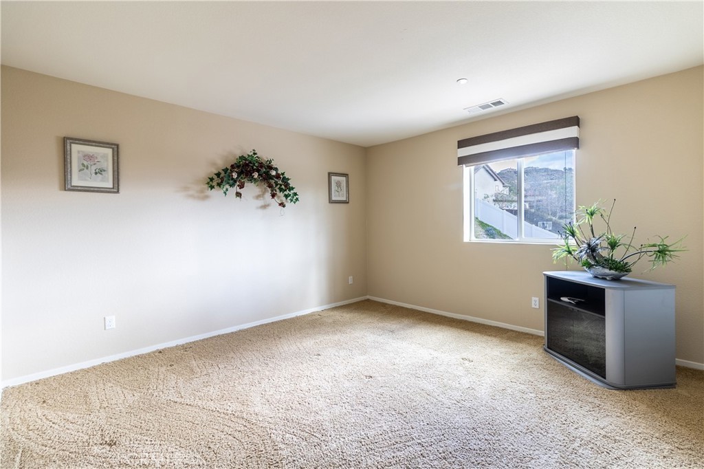 16657 Golden Bluff Loop Riverside, CA 92503 - Photo 27 of 47 a view of an empty room with a window