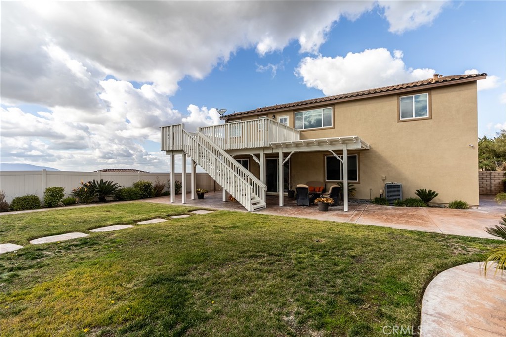 16657 Golden Bluff Loop Riverside, CA 92503 - Photo 36 of 47 a view of a house with a yard and porch