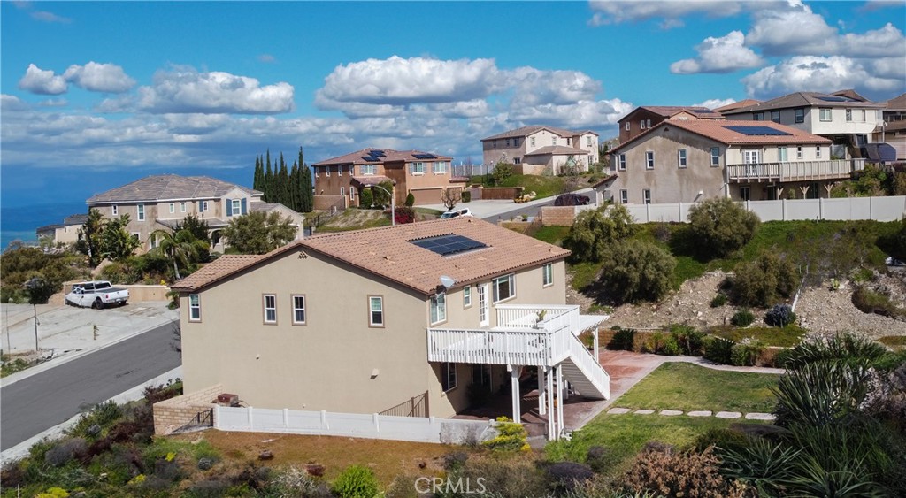 16657 Golden Bluff Loop Riverside, CA 92503 - Photo 44 of 47 a aerial view of a house with a yard