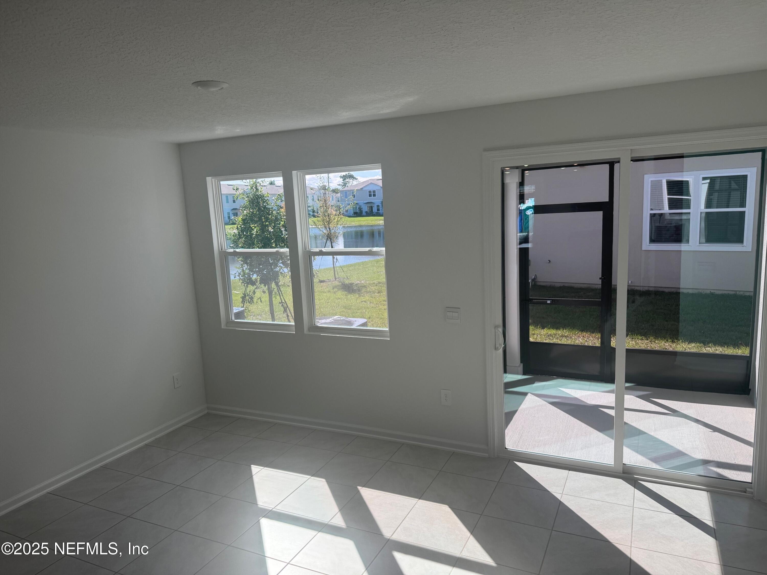 22 Blue Hvn Road St. Augustine, FL 32095 - Photo 12 of 59 a bedroom with a bed and a large window