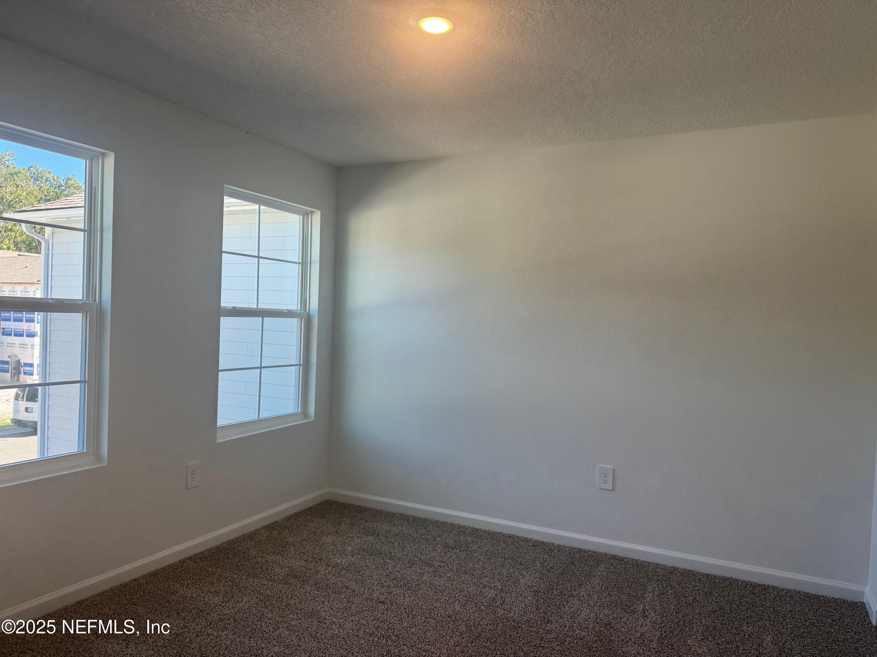 22 Blue Hvn Road St. Augustine, FL 32095 - Photo 22 of 59 an empty room with windows