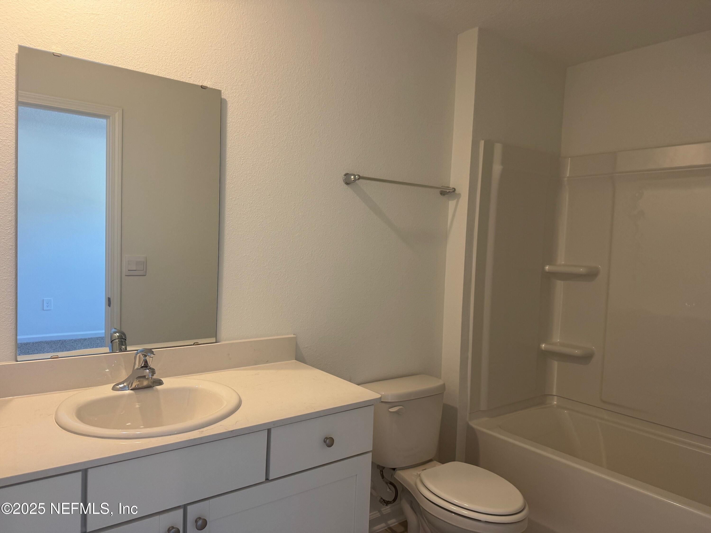 22 Blue Hvn Road St. Augustine, FL 32095 - Photo 25 of 59 a bathroom with a sink a toilet and shower