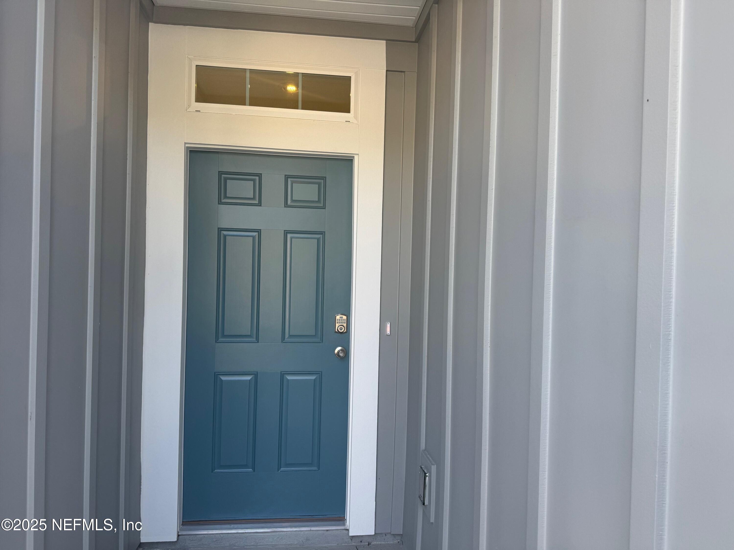 22 Blue Hvn Road St. Augustine, FL 32095 - Photo 3 of 59 a view of entryway with wooden floor