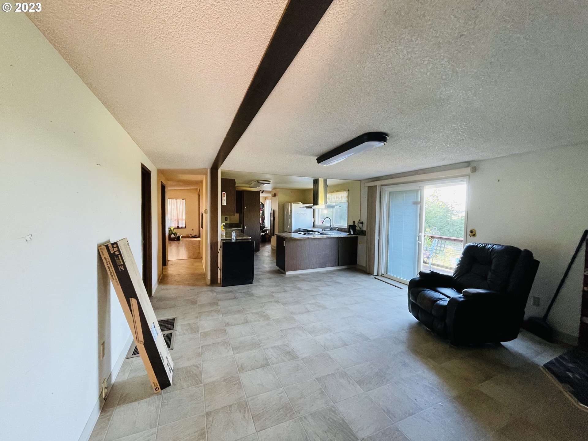 30985 Brownlee Road Rainier, OR 97048 - Photo 14 of 31 a living room with furniture and a refrigerator