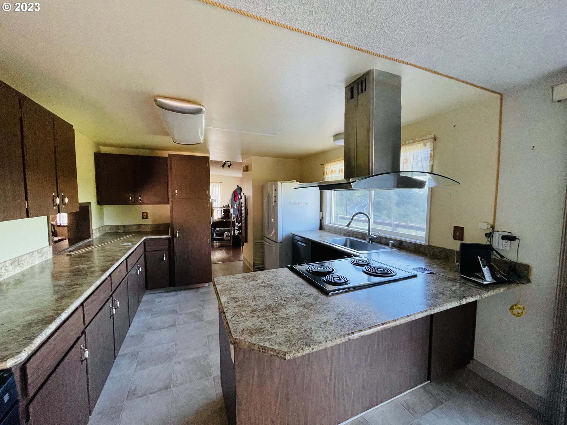 30985 Brownlee Road Rainier, OR 97048 - Photo 9 of 31 a kitchen with a stove and a sink