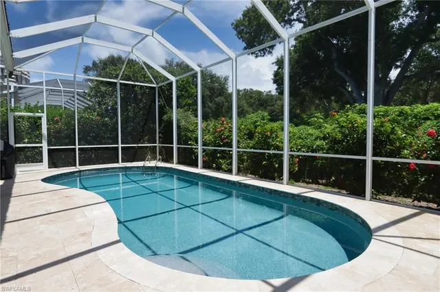 a view of a house with backyard and deck