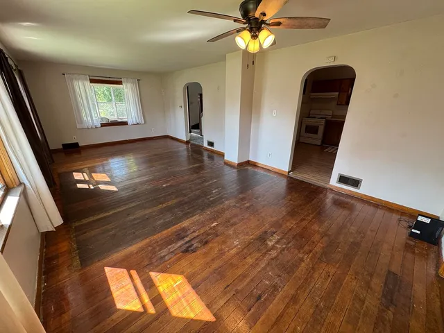 a view of an entryway with wooden floor