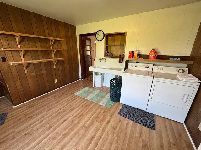 a room with a bed and a flat screen tv