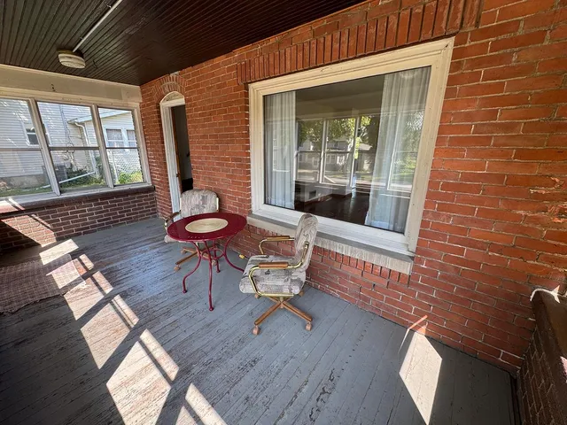 a view of a two chairs in the balcony