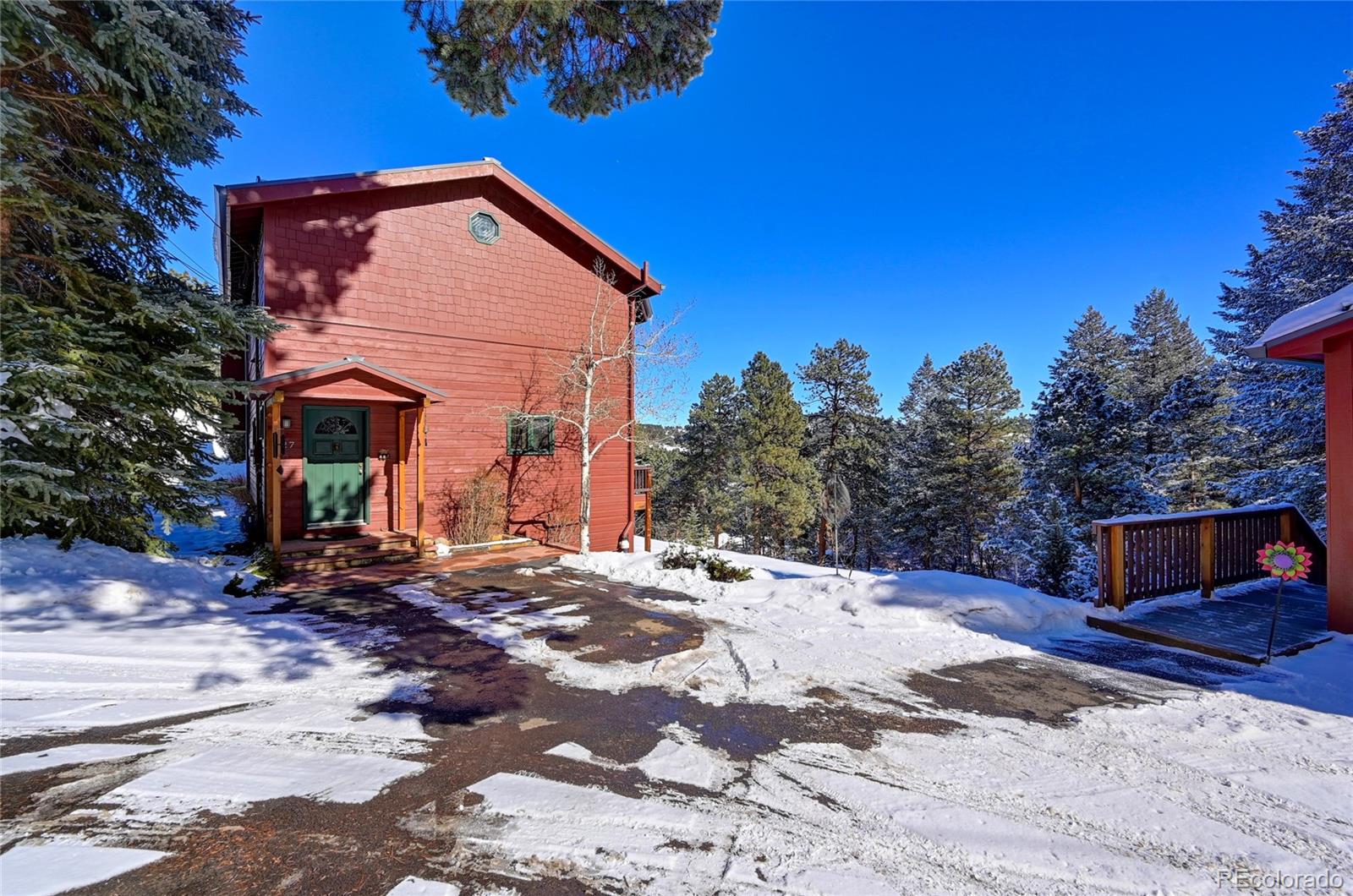 27 Conifer Road Golden, CO 80401 - Photo 1 of 40 a front view of a house with a yard