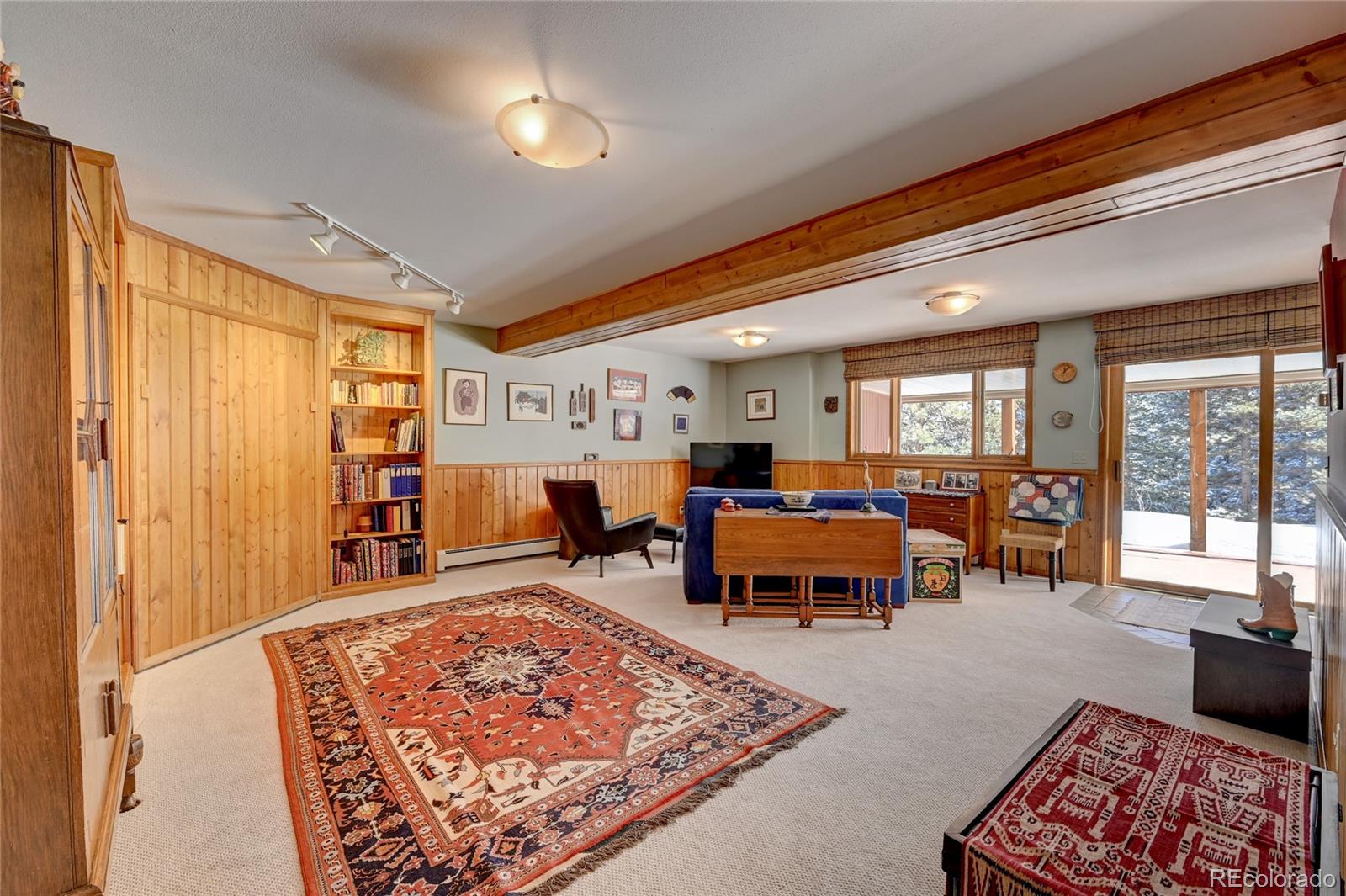 27 Conifer Road Golden, CO 80401 - Photo 30 of 40 a living room with furniture a rug and a window