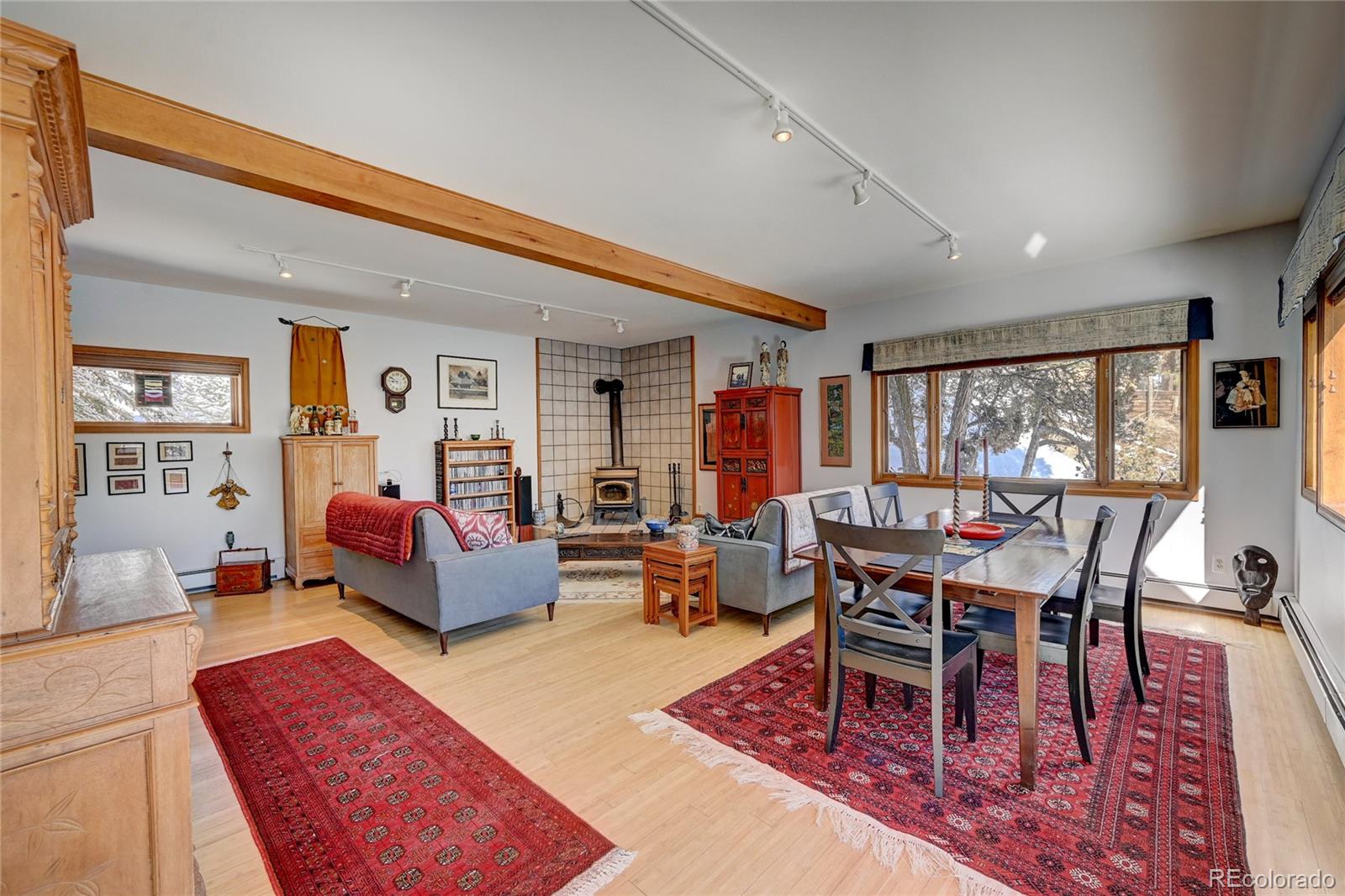 27 Conifer Road Golden, CO 80401 - Photo 8 of 40 a living room with furniture and a wooden floor