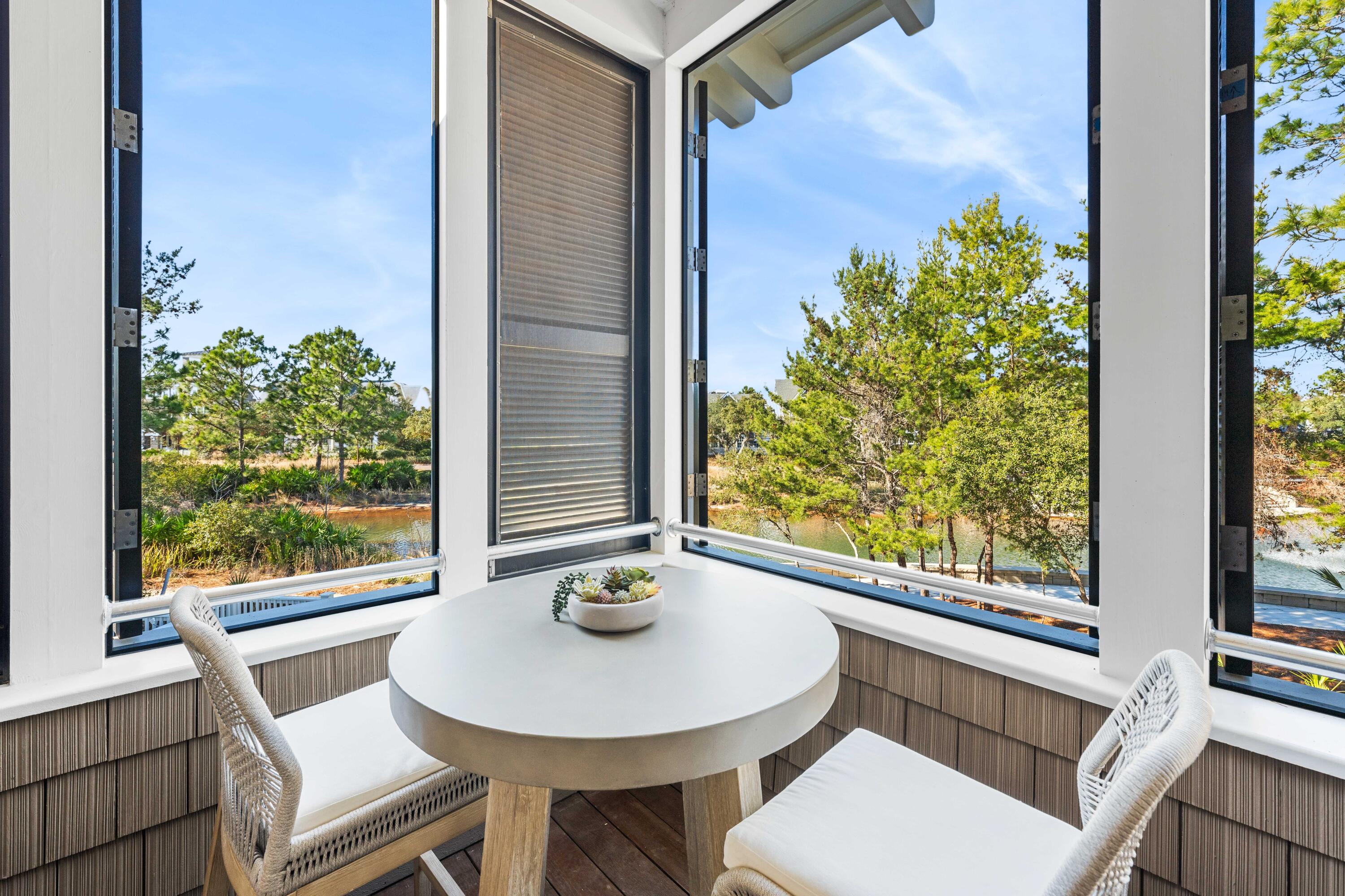 47 Compass Point Way Inlet Beach, FL 32461 - Photo 36 of 50 a view of a room with a table and chairs
