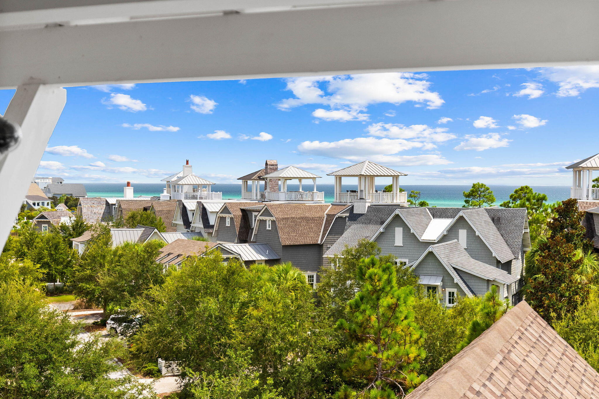47 Compass Point Way Inlet Beach, FL 32461 - Photo 43 of 50 a balcony with chairs and a table
