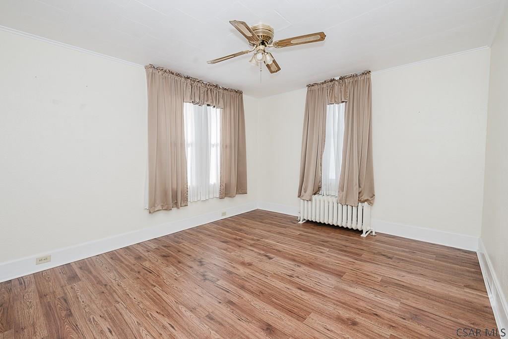 159 Wilson Street Johnstown, PA 15906 - Photo 9 of 27 an empty room with wooden floor and windows