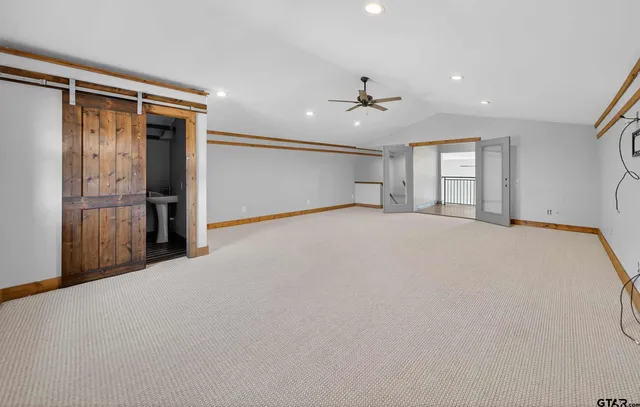 a view of a workspace with furniture and wooden floor