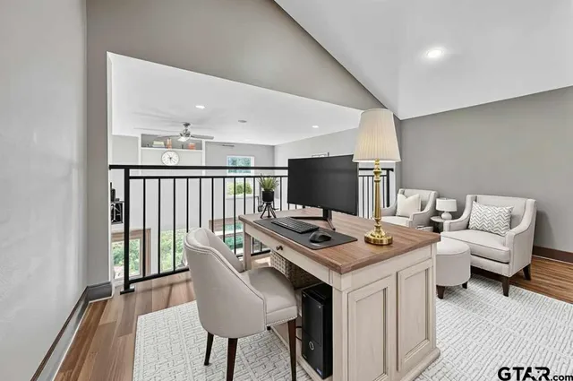 a view of a room with wooden floor