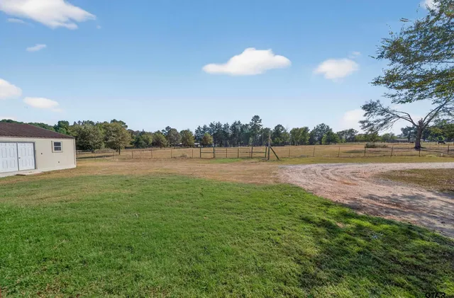 a view of a golf course with a lake