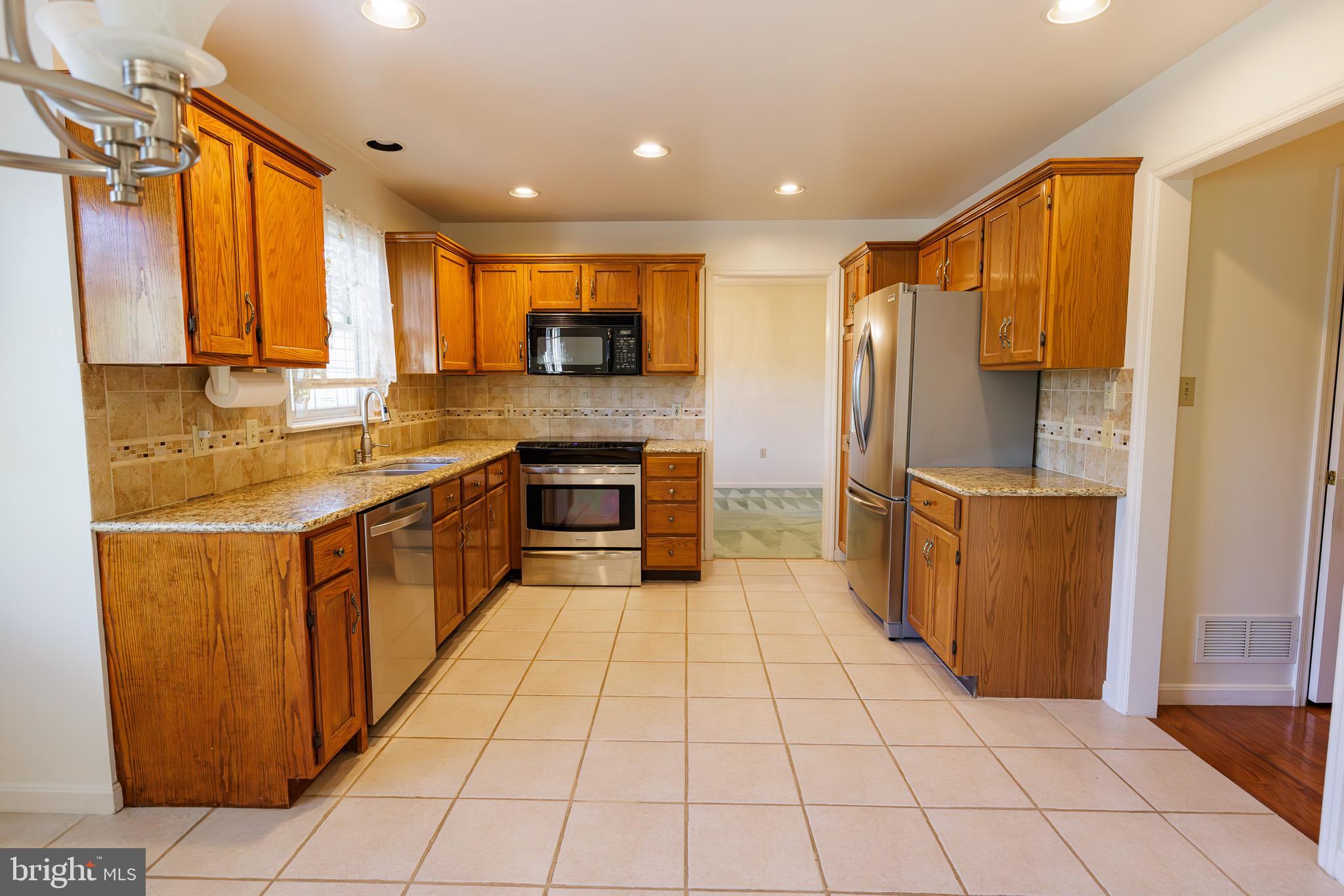 280 Raspberry Road Leola, PA 17540 - Photo 11 of 41 a kitchen with stainless steel appliances granite countertop a refrigerator and a stove