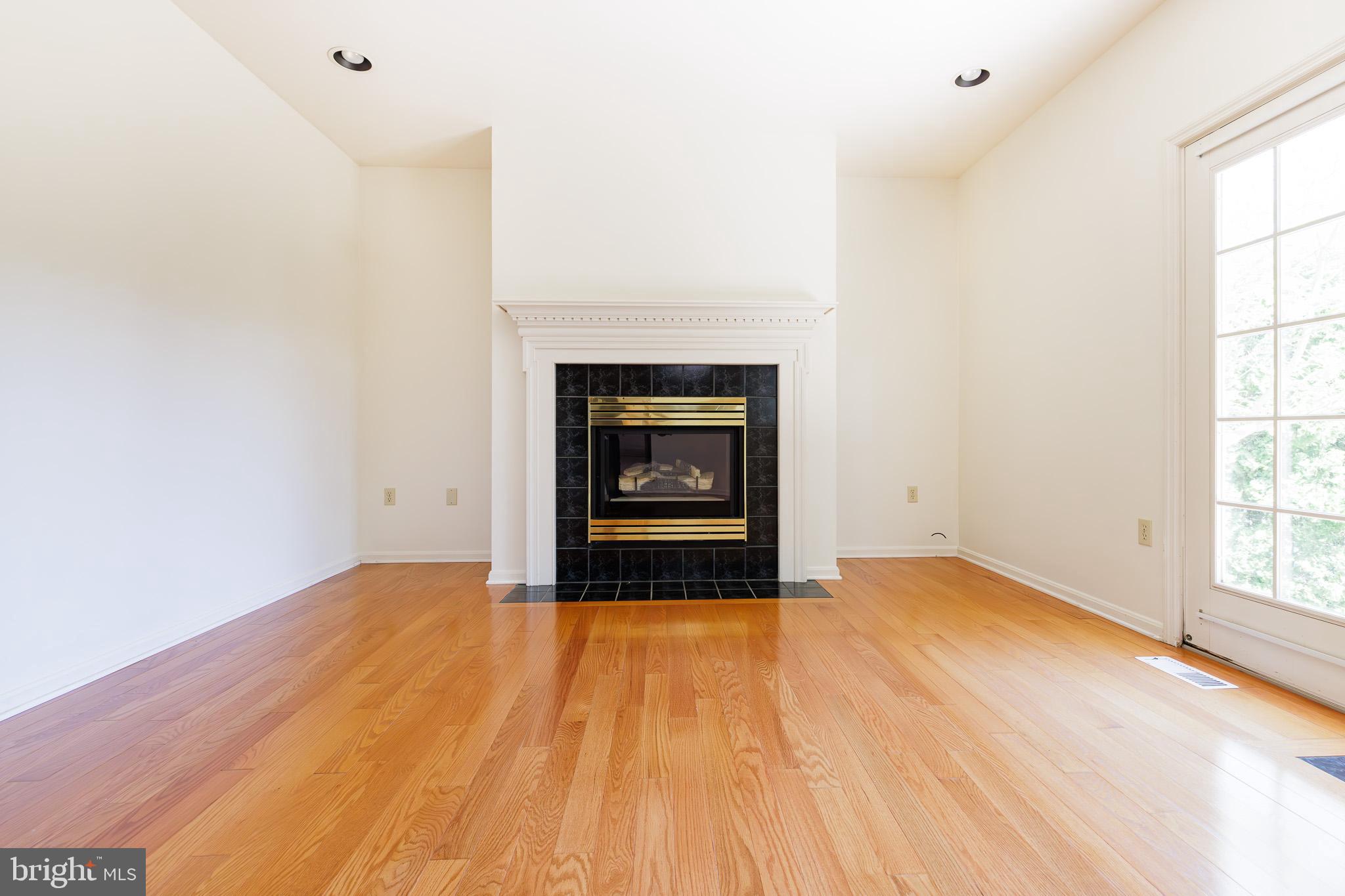 280 Raspberry Road Leola, PA 17540 - Photo 17 of 41 a view of an empty room with a fireplace and a window