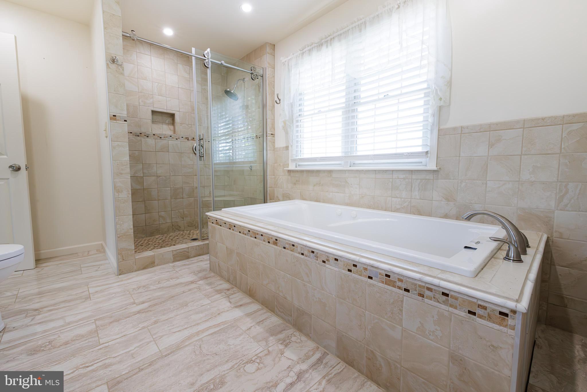 280 Raspberry Road Leola, PA 17540 - Photo 23 of 41 a bathroom with a tub a sink and a shower