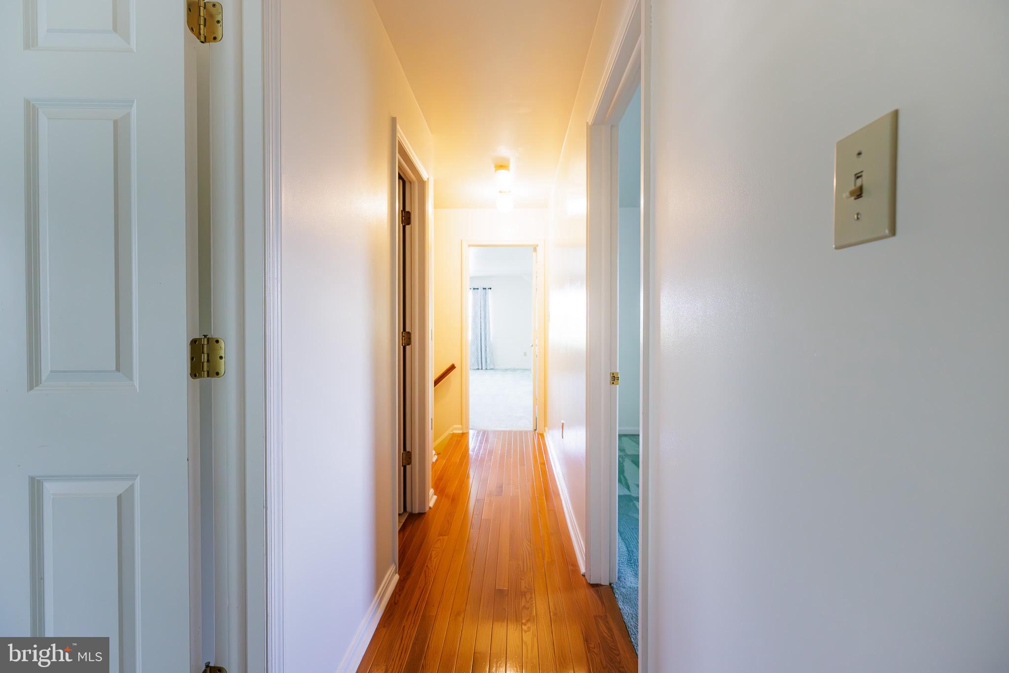 280 Raspberry Road Leola, PA 17540 - Photo 25 of 41 a view of a hallway with wooden floor and a bathroom