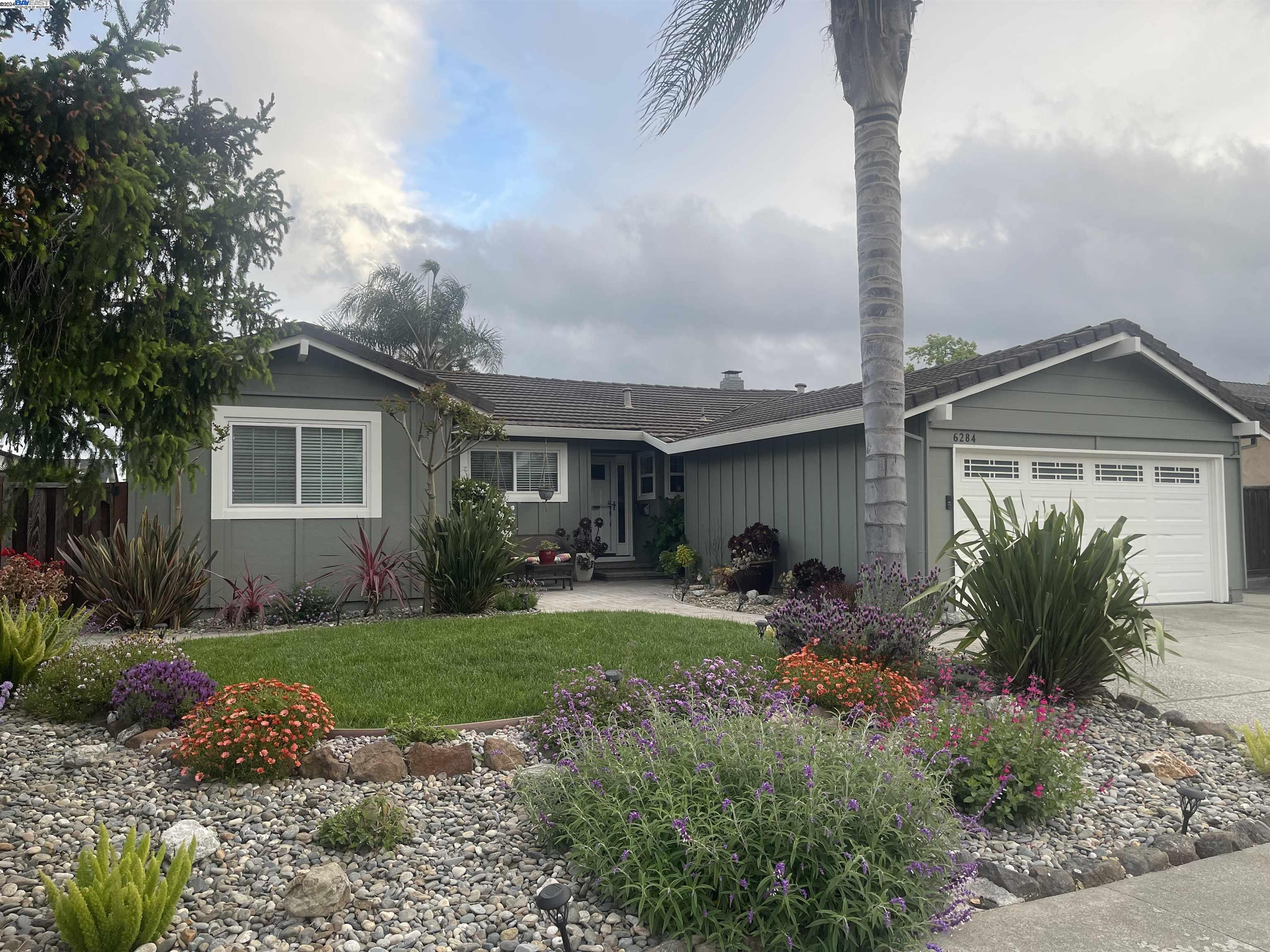 a front view of house with yard and seating area