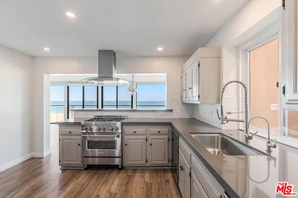 a view of a kitchen with wooden floor