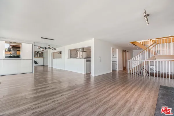 a view of a livingroom with wooden floor