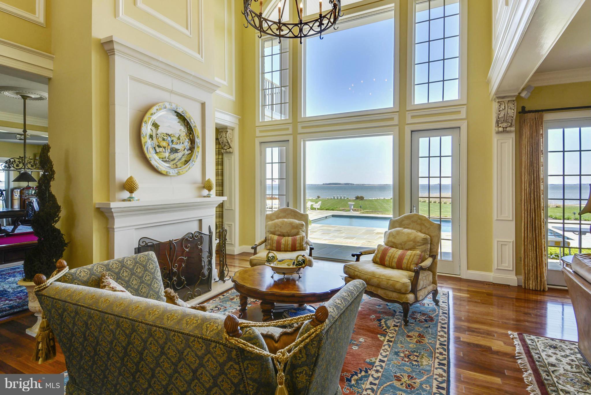 2925 Cox Neck Road East Chester, MD 21619 - Photo 5 of 30 a living room with fireplace furniture and a large window
