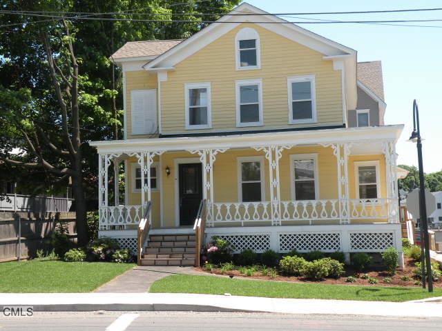 130 Main Street, Unit D2 Norwalk, CT 06851 - Photo 1 of 1 a front view of a house with a yard
