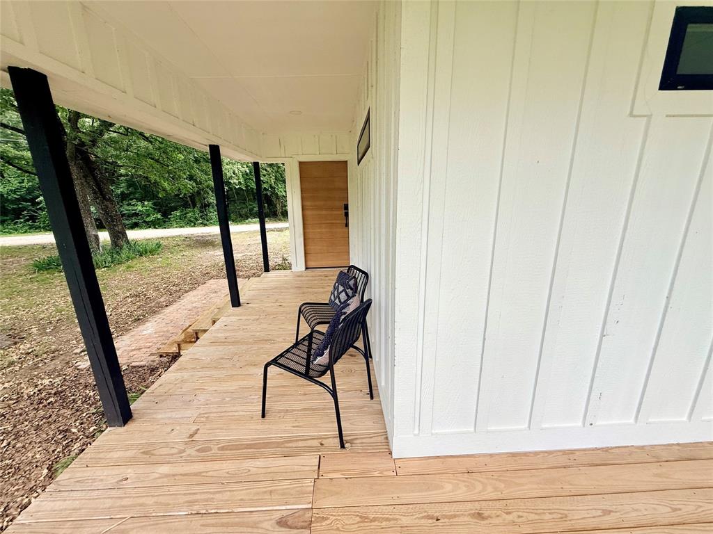 250 Skyview Point, TX 75472 - Photo 22 of 22 a view of a room with wooden floor and windows