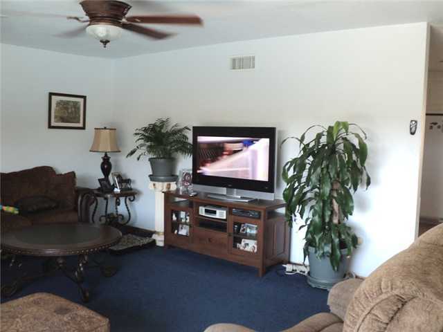 8859 Los Coches Road Lakeside, CA 92040 - Photo 11 of 25 There are several large walls in the living room which will accommodate an entertainment center. The opening at the right leads to the dining room and kitchen.