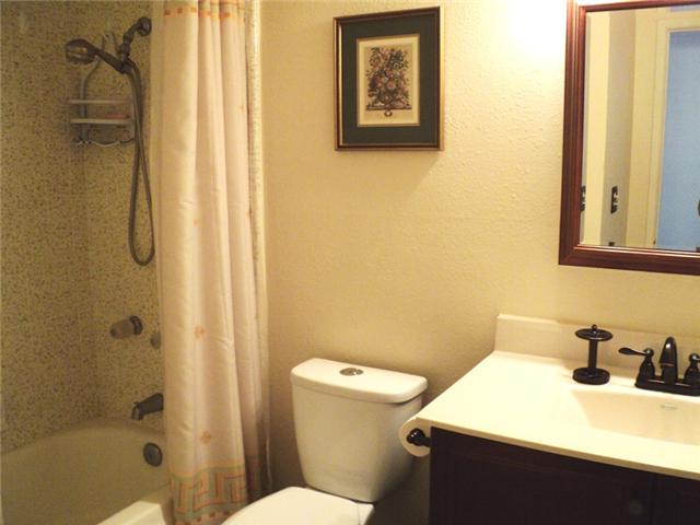 8859 Los Coches Road Lakeside, CA 92040 - Photo 12 of 25 The hall guest bath is just a few steps away from the living room and two of the bedrooms.