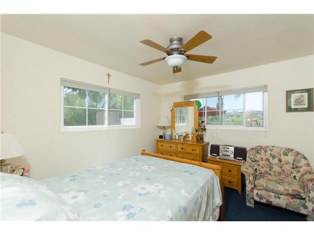 8859 Los Coches Road Lakeside, CA 92040 - Photo 15 of 25 This bedroom is at the southwest corner of the house, with two windows. Both auxiliary bedrooms have spacious closets.