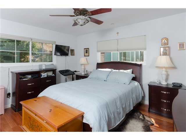 8859 Los Coches Road Lakeside, CA 92040 - Photo 16 of 25 The master bedroom is at the back of the house and has a private master bath, 2 wardrobes and a ceiling fan.