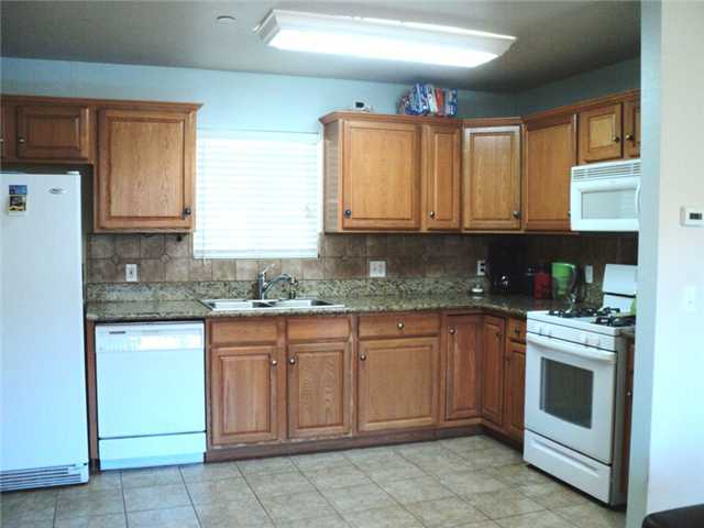 8859 Los Coches Road Lakeside, CA 92040 - Photo 20 of 25 This is the kitchen in the 2nd home, with beautiful oak cabinets and granite countertops.