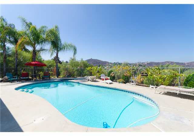 8859 Los Coches Road Lakeside, CA 92040 - Photo 3 of 25 The pool area has a sweeping view of the hills and mountains to the west.