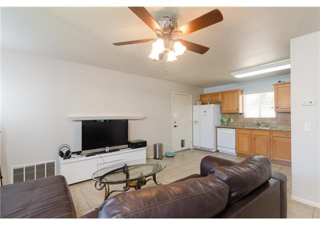 8859 Los Coches Road Lakeside, CA 92040 - Photo 21 of 25 This spacious living room is open to the kitchen, creating a great room effect.